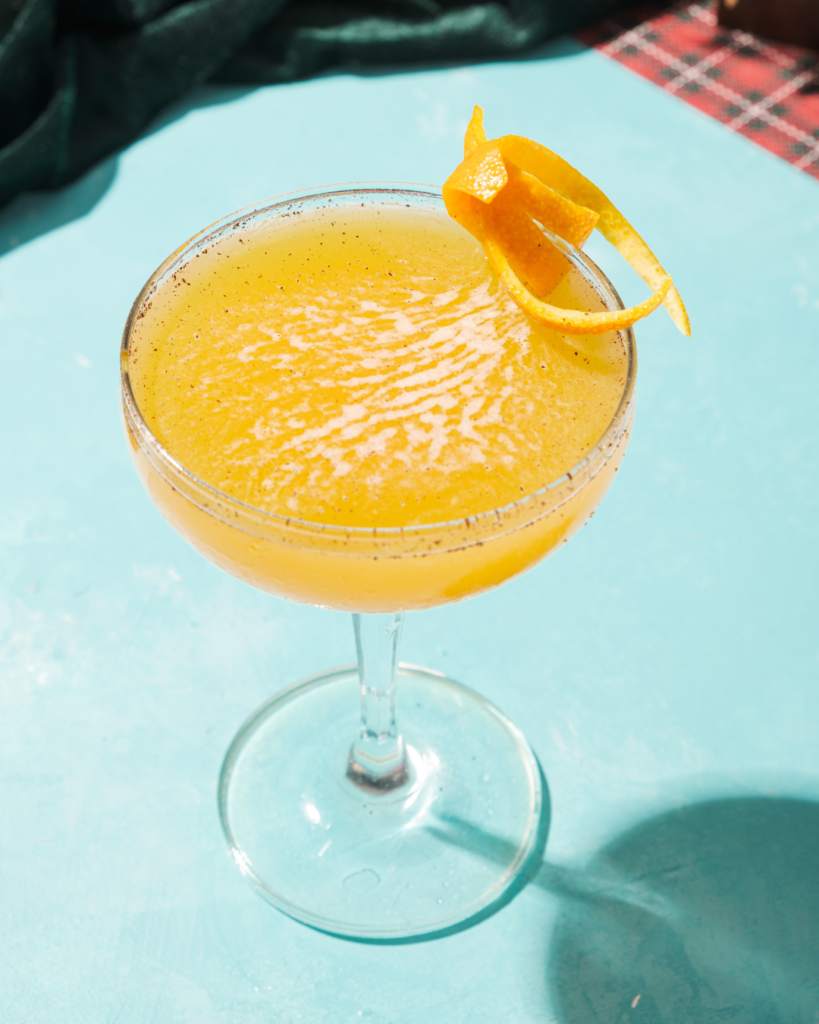 Tittos Latin BBQ and Brew Holiday Mocktails Black Truffle Sunrise
